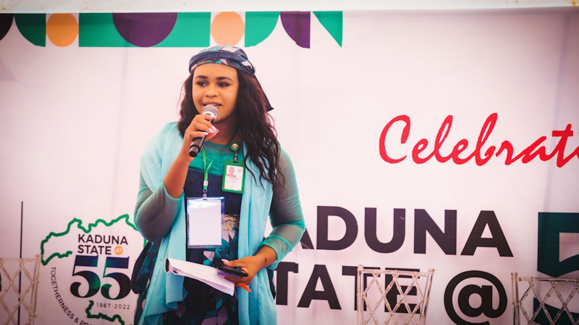 Preview image for the video "Sharon Takim" - A young light-skinned Black woman with long hair speaks into a microphone on a stage.