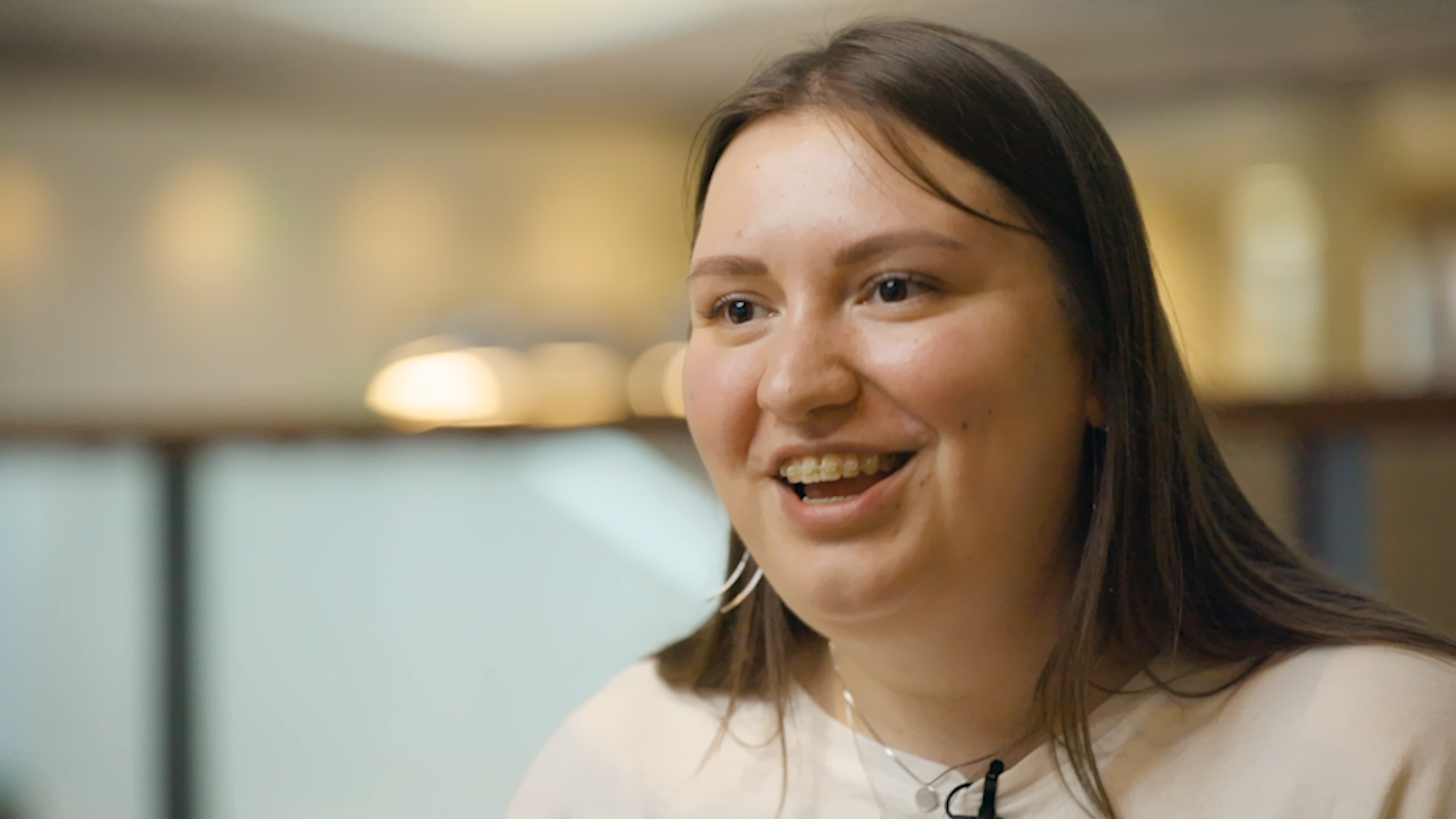 Preview image for the video "In Ukraine, Olena Pavliuk is supporting students to learn and thrive while living through a war" - Headshot of a white woman with brown hair wearing a white t-shirt.