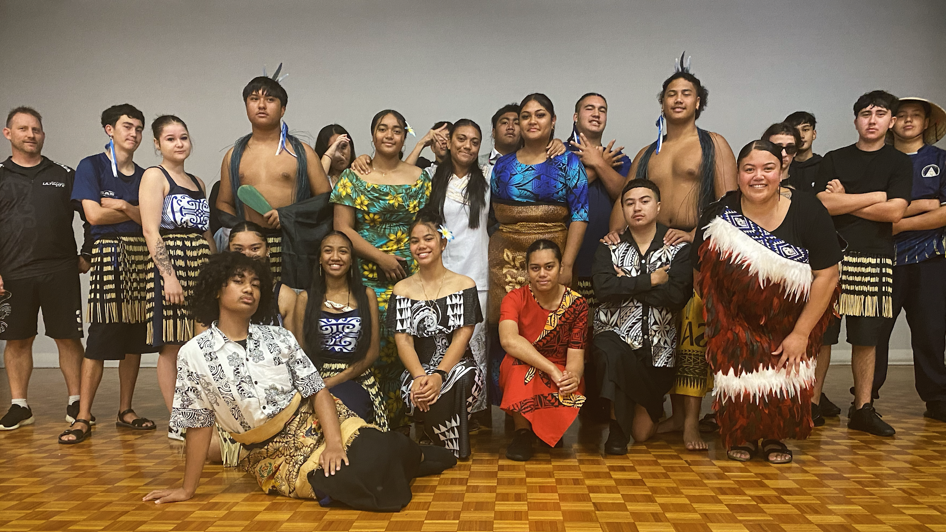 Preview image for the video "Te Moana Maika embeds Māori concepts of love, care, connection, and family into her classroom" - A group of teenagers and young adults in traditional indigenous attire.