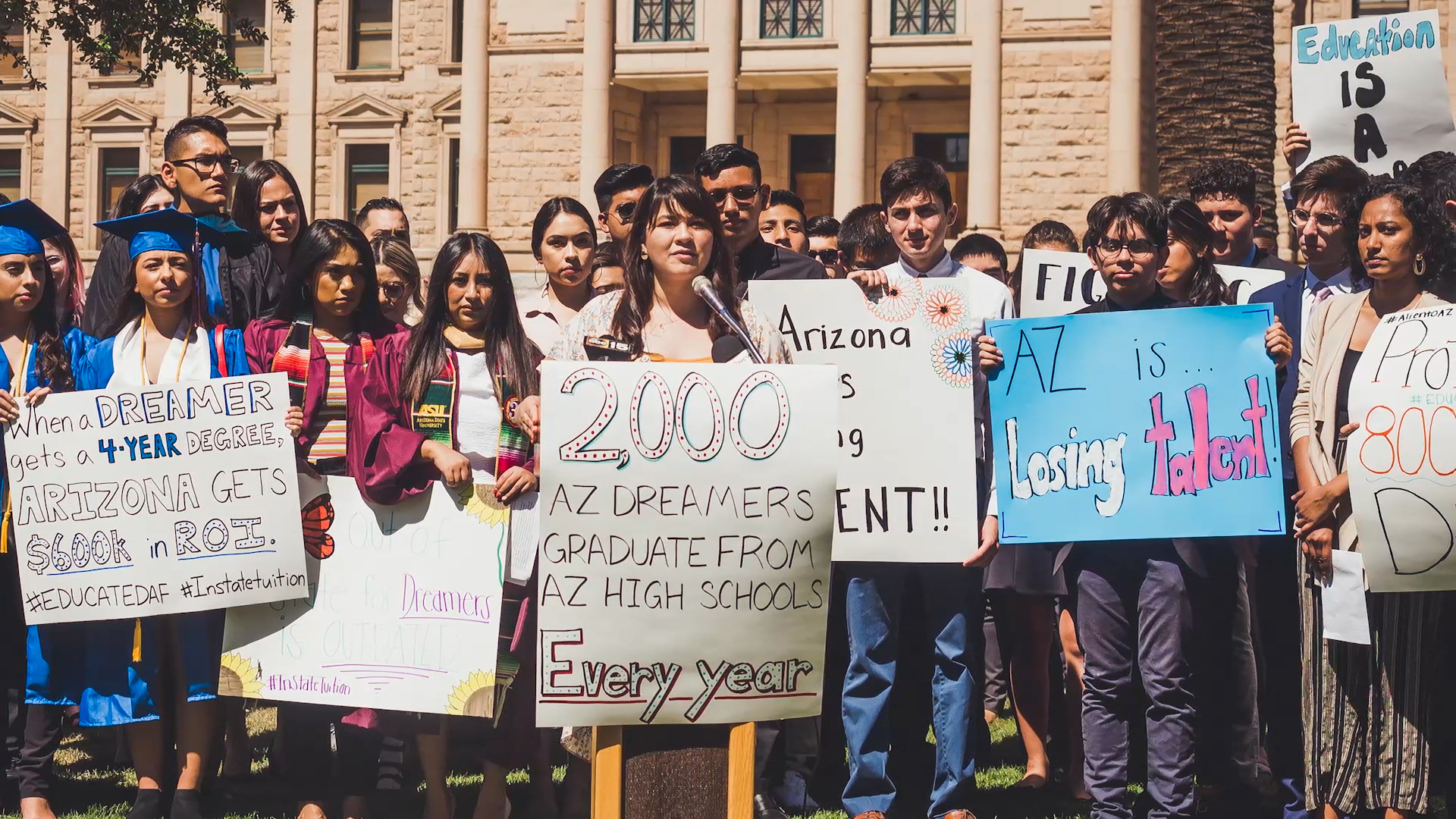 Preview image for the video "In the US, Reyna Montoya is helping undocumented young people tranform fear into hope and action" - A group of young people hold up signs advocating for the rights of undocumented people in the US.